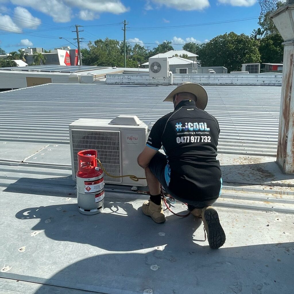 Townsville air conditioner repair job on roof.